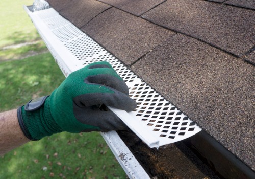 Man installing Gutter Guards in Peoria IL