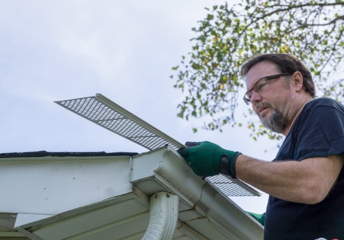 Professionals installing Gutter Protection in Peoria IL