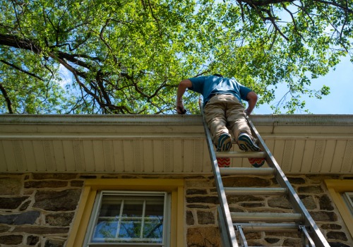 Technician installing Gutter Protection for East Peoria IL home